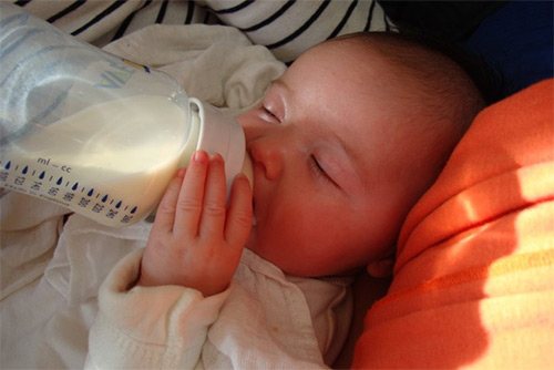 baby eats from a bottle
