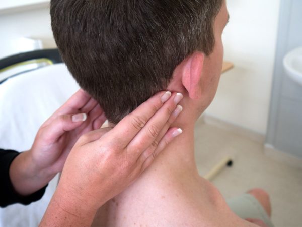 Examination of lymph nodes behind the ears