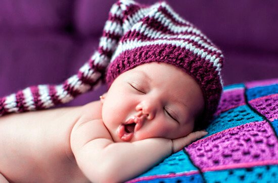 Sleeping with your mouth open is absolutely normal for an infant.